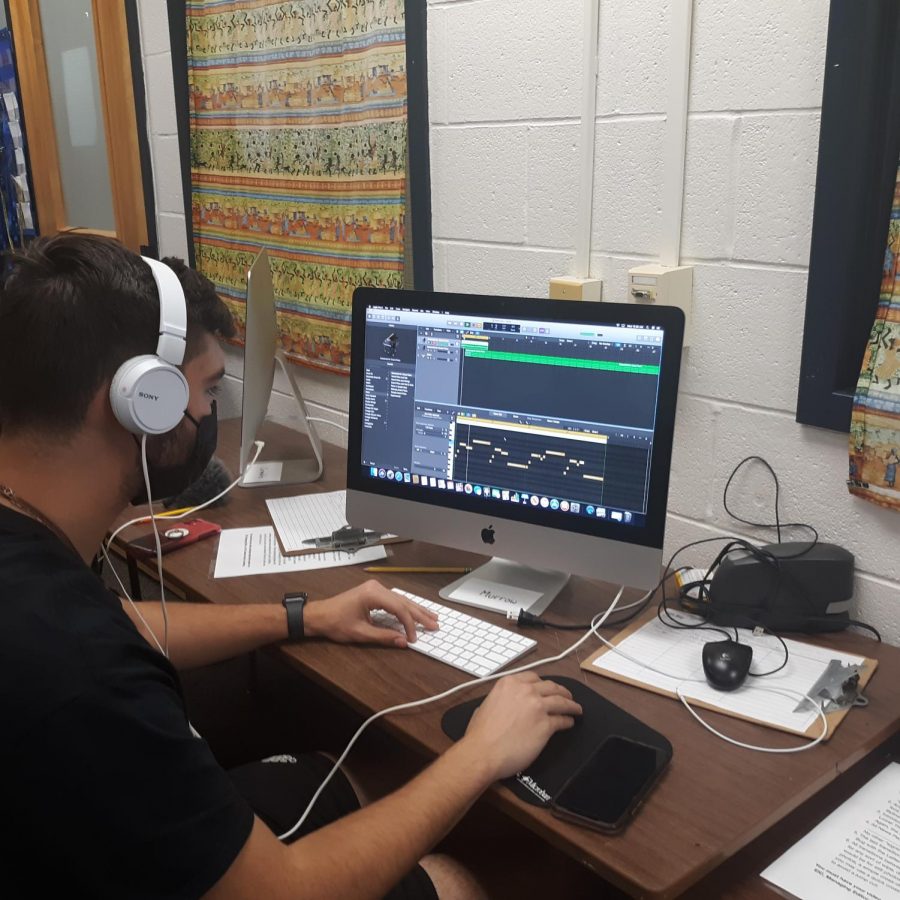 Electronic journalism class is busy setting up the studio in order to broadcast News Briefs.  BNN managing editor Ethan Gilding is working on Logic Pro X software to create music for the upcoming broadcasts.  
