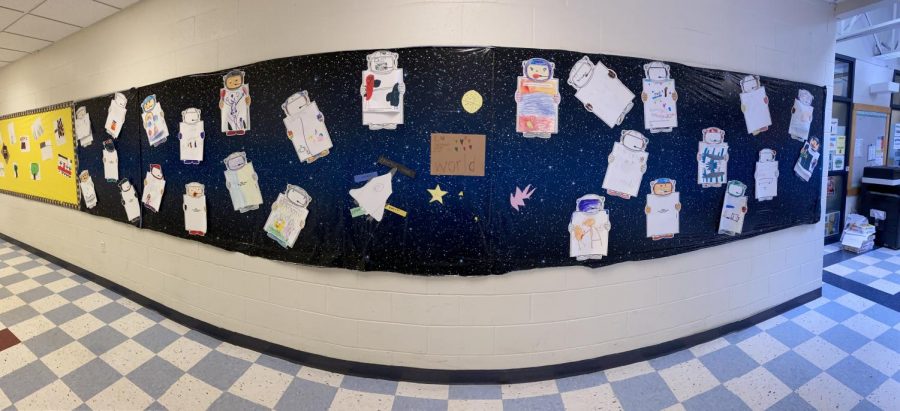 This colorful bulletin board is in the elementary hallway. Students wrote about something they liked and then drew a picture of it as an activity to get to know each other better.  