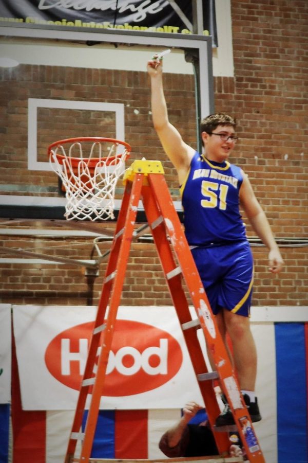 BMU Senior Jacob Dube cutting down the net at the Barre Aud.  Dube hit the game winning 3-pointer as time expired to lift the Bucks to their first state championship since 2001