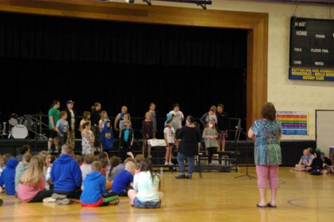 Elementary students fill the school with the sounds of spring as they practice for their first concert since Covid.