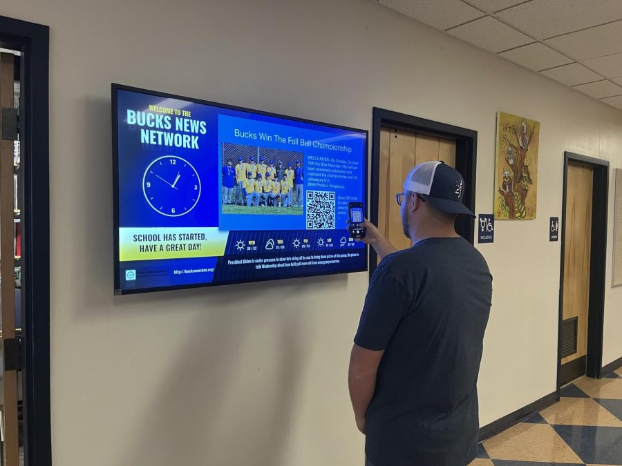 Junior Owen Murray checking out the new TV for the latest announcements. BMU is shifting from verbal announcements to digital announcements.