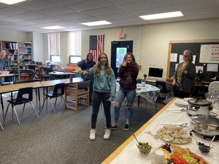 SNHU History students Lauren Joy, Gabby Houghton and Karli Blood are ecstatic over their holiday meal in Neil Emersons room, on Monday, November 2nd. 