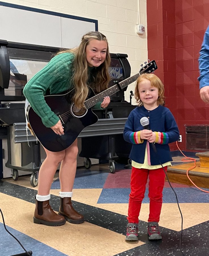 Junior Karli Blood and pre-schooler Muriel LaCoss sing Rainbow by Kacey Musgraves, to the whole elementary at the PBIS assembly on January 6th, 2023. 