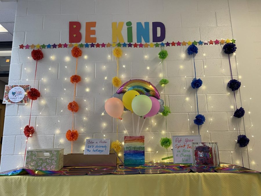 January 27, 2023, Elementary hallway sets up booth for this years Kindness Challenge; featuring a poster submission to decorate the hallway and spirit tickets the students have been earning to win a prize.