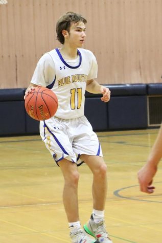 Cedric Shafer dribbles up the floor against the Oxbow Olympians on Monday, January 30th.