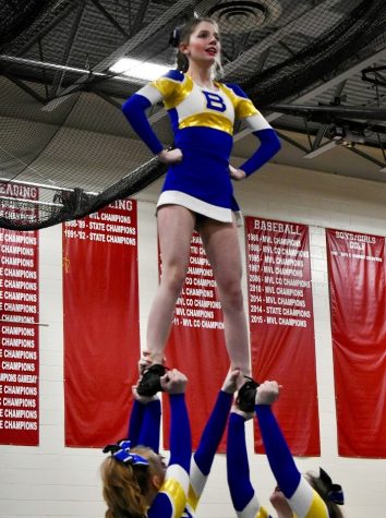 Varsity Cheerleaders Lexi Ball (top), Rachel Frey (bottom left) Sarah Frey (bottom right) and Kaylee Hillesland (back) preforming an extension stunt for Mill River High Schools Cheerleading competition.