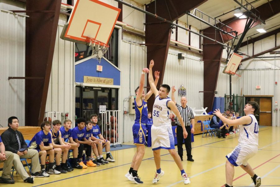Evan Dennis puts up a 3 pointer.