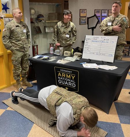 BMU Sophomore Jessica Pinette completes the Vermont National Guard  plank contest while wearing a 20 pound bulletproof vest. 