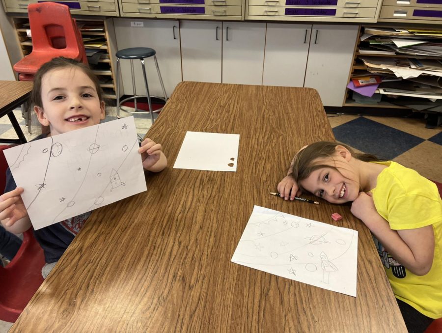 First graders Harmony Scott and Artemiss Smith display their hard work in art class on Friday March 24th, 2024. 