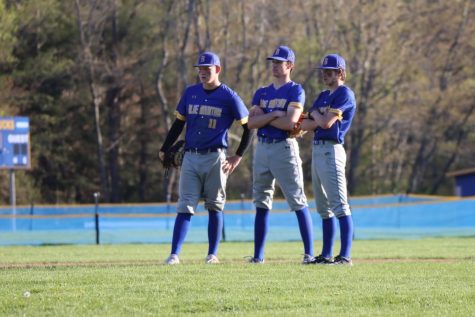 The Bucks infielders look on while Kris Fennimore throws his warm up pitches, on Tuesday, May 9th. 