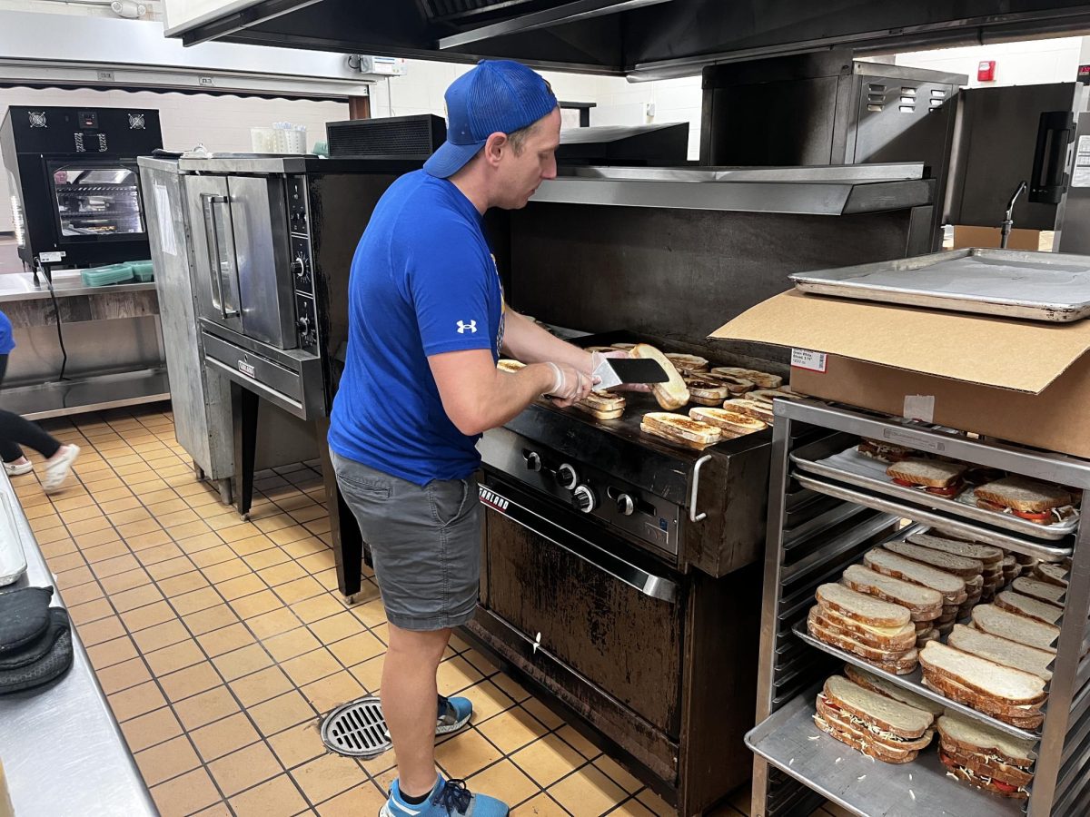 Food Service Director Paul Pellegrino flips grilled cheeses in preparation for lunch on Friday Sept 22. Todays lunch is regular or tomato pesto grilled cheese, and tomato soup.