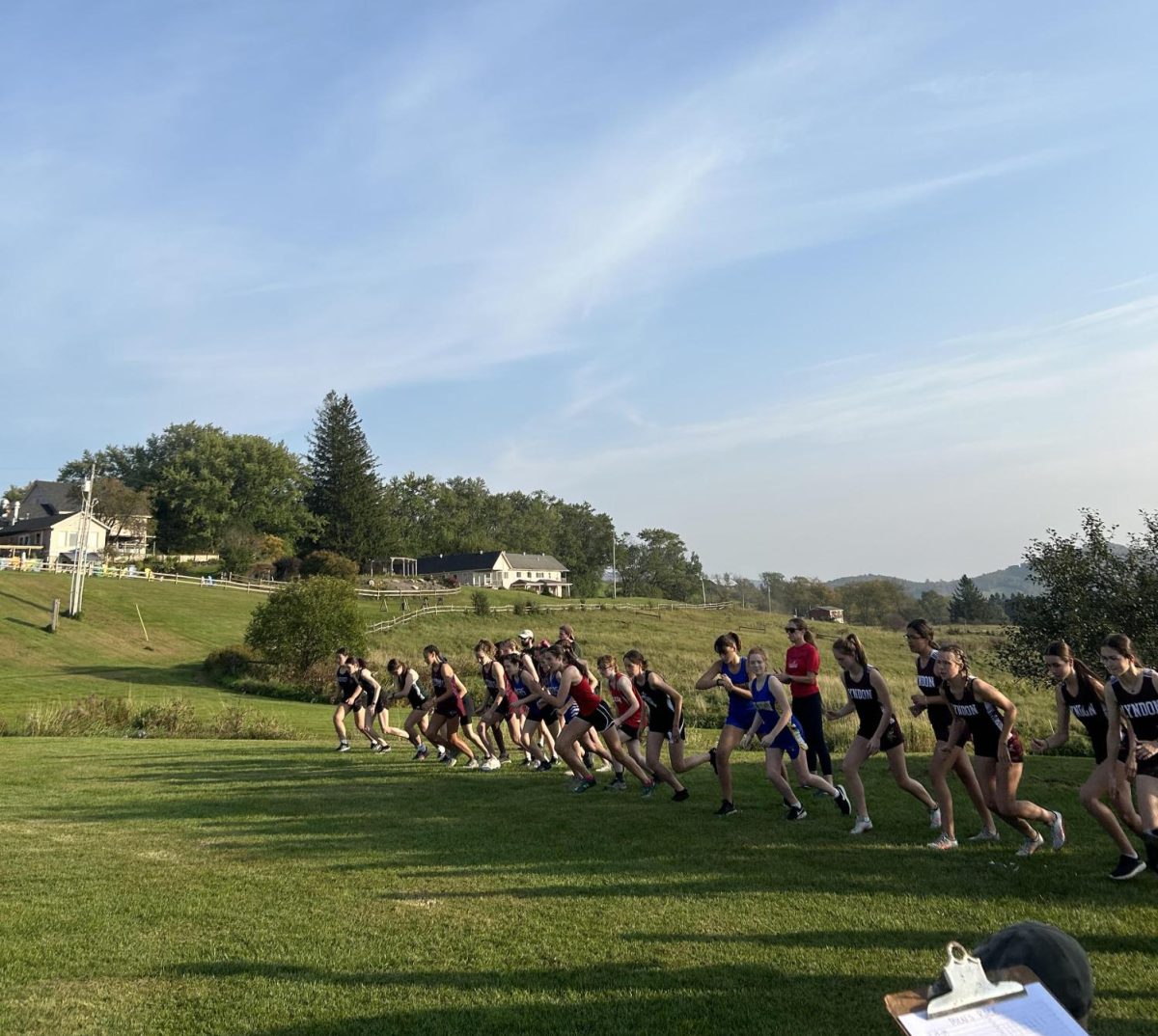 Runners from 8 different schools line up at the Lyndon Institutes girls high school 5k race on September 27th, 2023. 