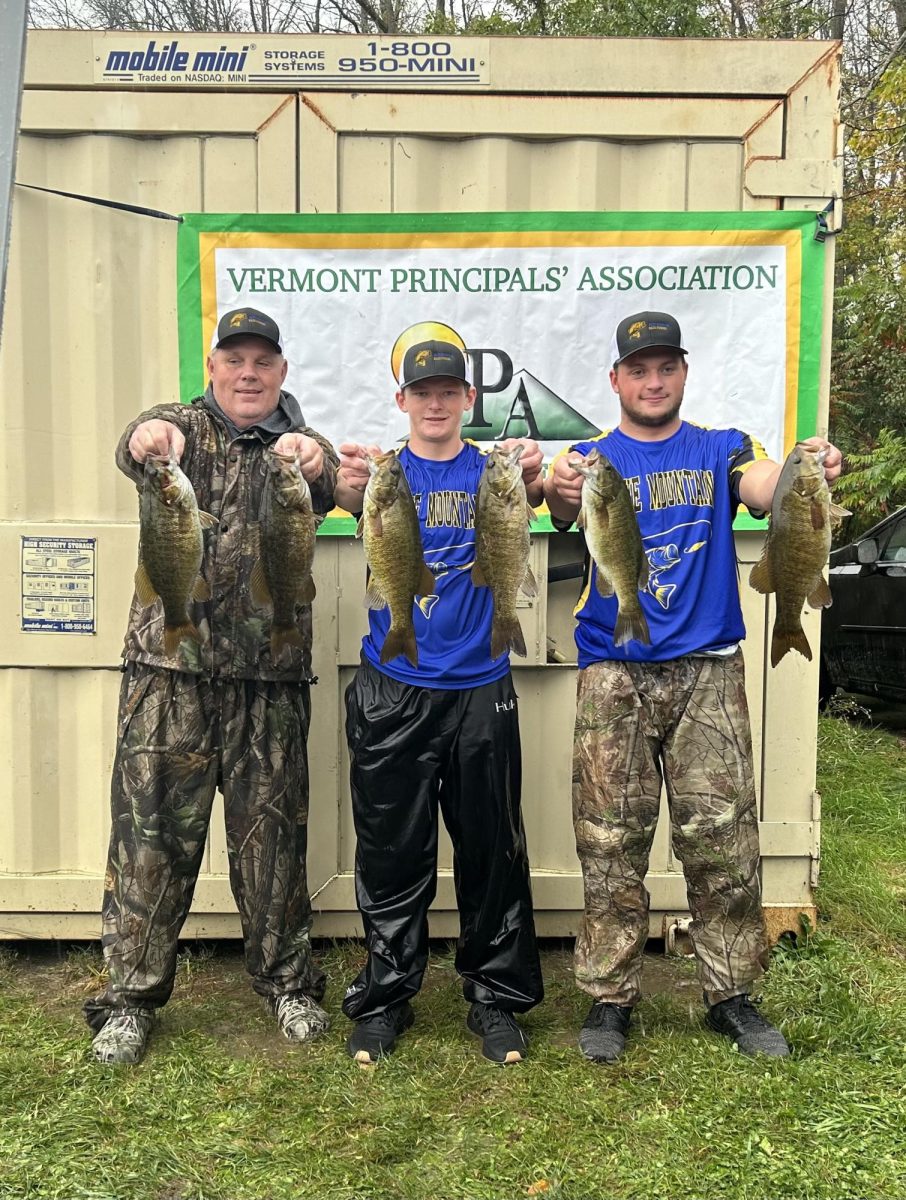 Bass+fishing+coach+Will+Kingsbury+is+helping+hoist+up+the+fish+that+anglers+Kason+Blood+and+Brody+Kingsbury+catch+in+the+2023+VPA+state+tournament.+15.59+pounds+places+them+6th+amongst+21+varsity+boats.