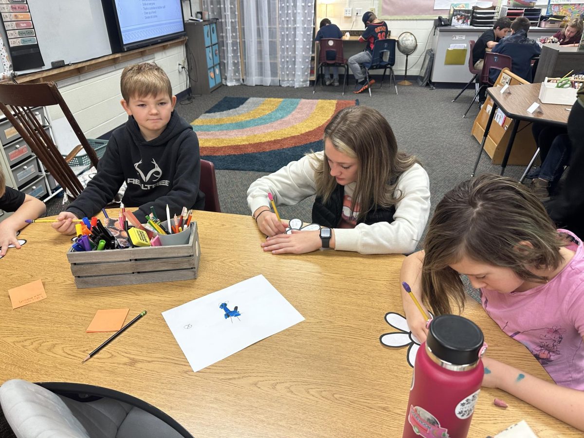 Senior Jordan Alley working on her kindness flower with third graders on November 8, 2023.