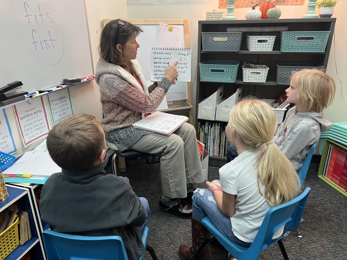 On November 7th 2023, Sandy Parker, the reading interventionist in elementary is teaching the new direct instruction (reading mastery) to students Levi Keith, Riley Emerson and Wesley Brown. Reading mastery is being implemented for elementary students from kindergarten to second grade.