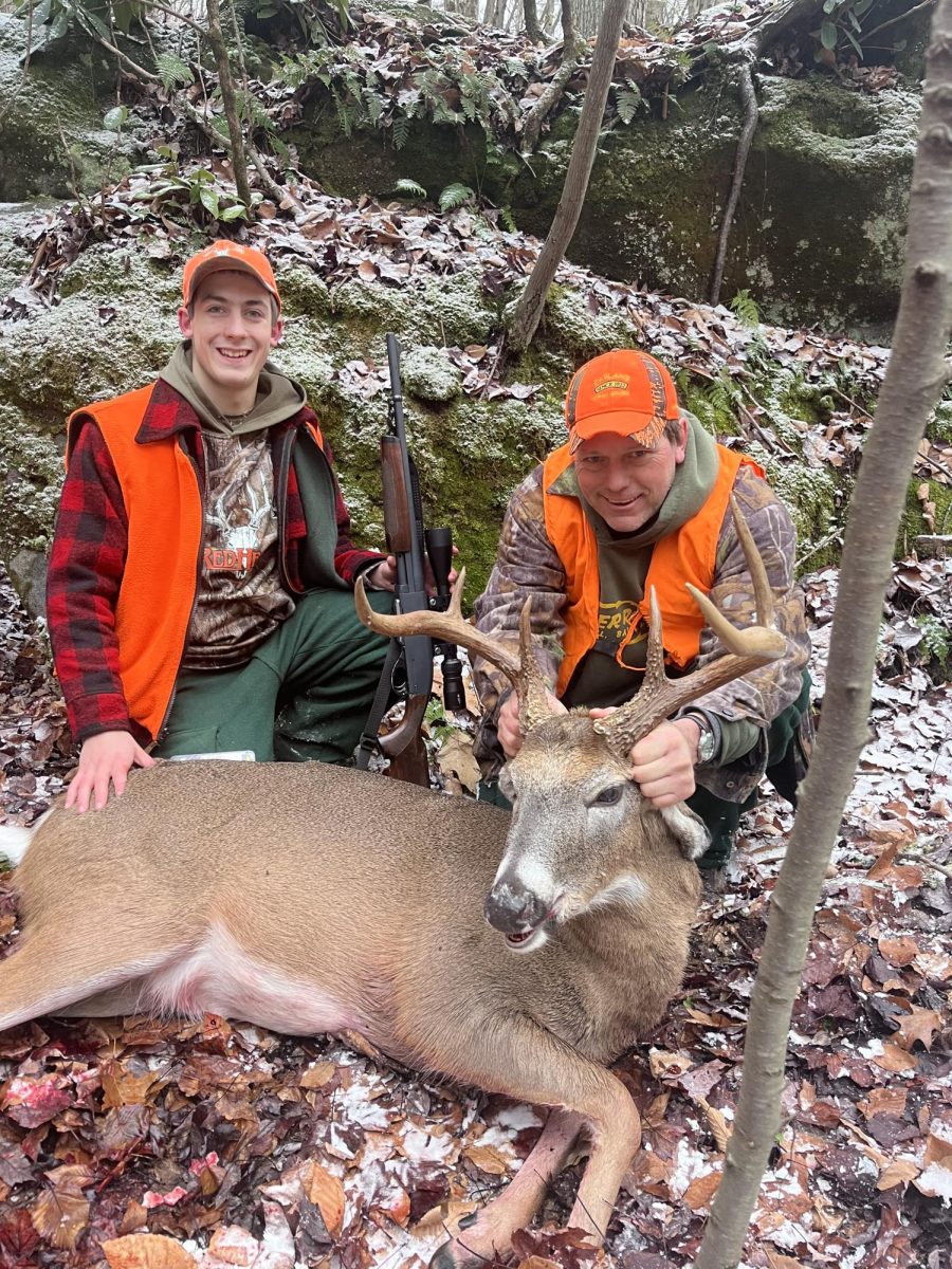 Senior Luke Peters kneels with his father, Toby Peters, holding up a nice 6 point buck taken on December 7th 2023. 