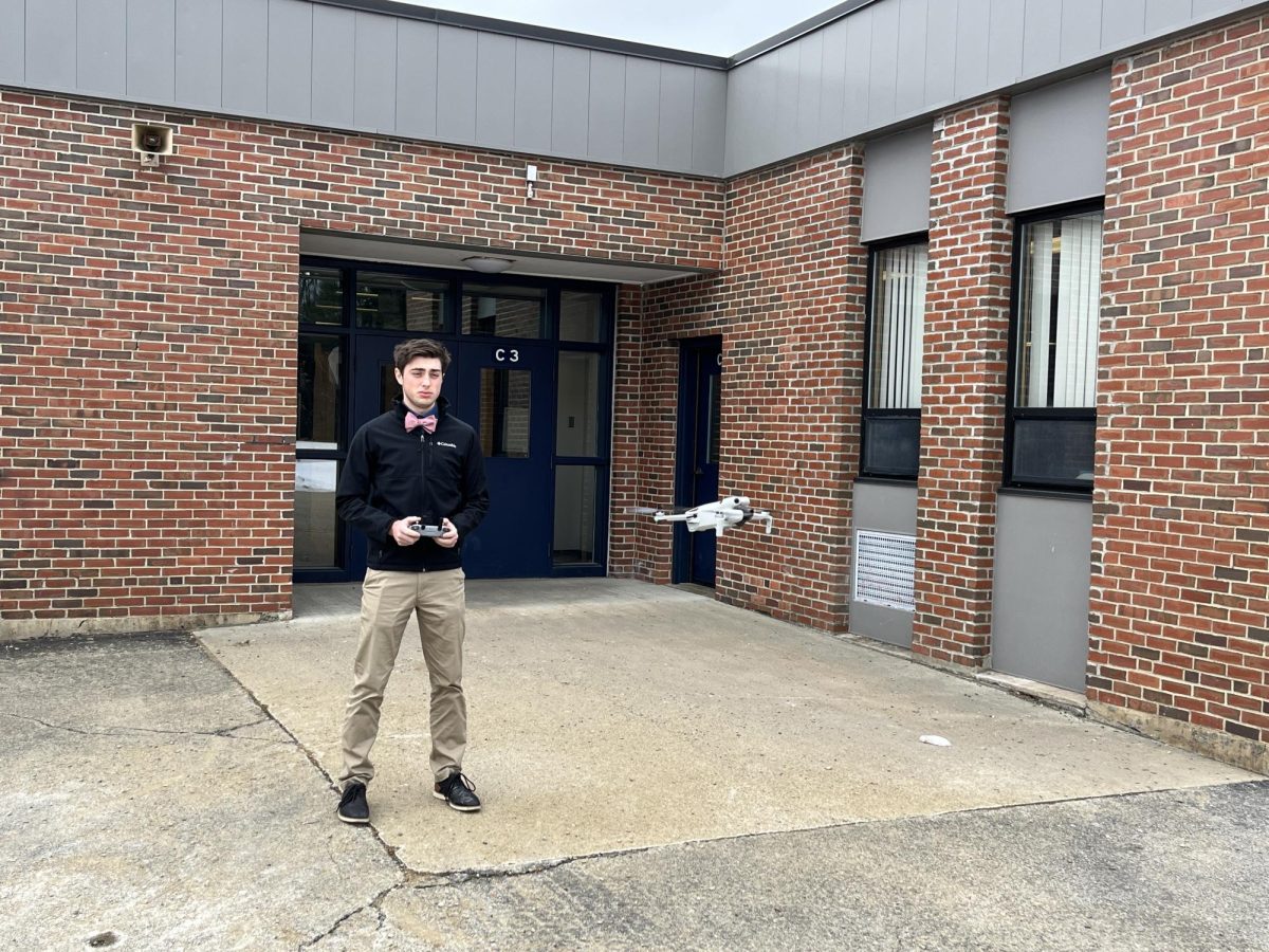 Will Emerson is seen here launching the new drone acquired by BNN  on December 8th, 2023.  This new tool allows the student-journalist to get overhead shots that simply were not possible before.