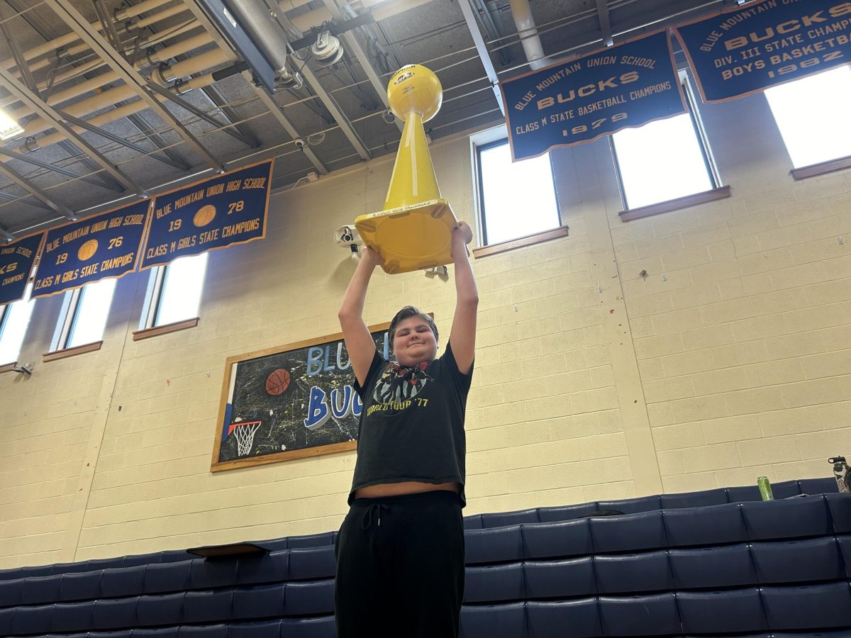 Blue Mountain sophomore Danny Gelsleichter hoists the Nitroball tournament trophy after his team brings home the win. At the Dr. Harry M. Rowe Gymnasium on February 9th, 2024.