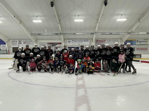 Youth participants and Kingdom Blades players pose for a photo following the youth clinic held at the Fenton Chester Arena on February 16, 2024.  This clinic known as the Future Blades Practice is an annual event.