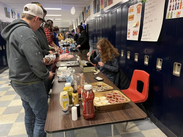 BMU junior Susanna Nelson helps man the concession stand at the Bucks vs. Rockets basketball game on Tuesday, Feb 6th, 2024. Junior year is a big year for class fundraising and fans are glad to have the hot food and snacks.