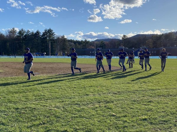 The Blue Mountain Bucks run back into the dugout after their win with pitcher Owen Murray leading the team.  Tuesday April 16, 2024.