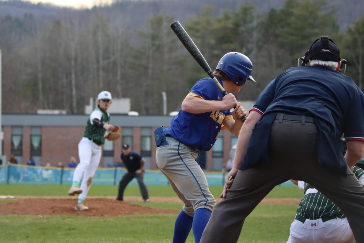 BMU junior Kason Blood takes a pitch from Woodsville senior Jack Boudreault. 