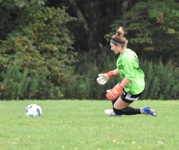 Sophomore Ava Kingsbury saves the ball after a shot on goal at Winooski on October 15, 2024. 