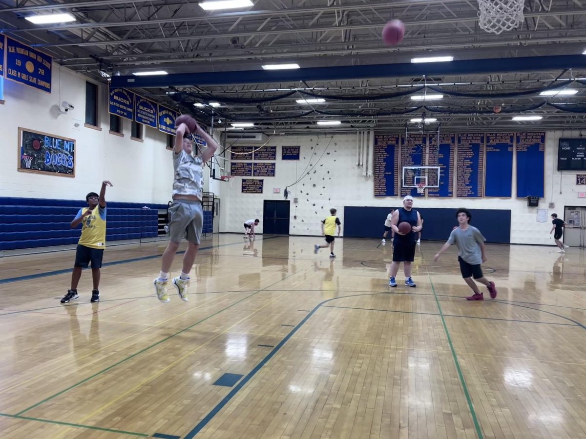 Boys participate in warm ups before the start of Open Gym, on November 13, 2024 in Wells River, Vermont. 