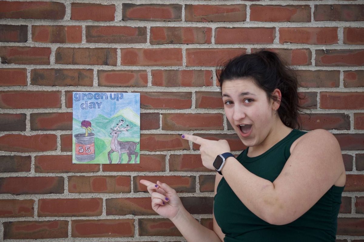 On Wednesday, February 12, BMU student Madalyn Houghton is seen posing with her winning poster for the 55th annual Green Up Day poster contest in the 9-12 category. According to Green Up Vermont's Executive Director, Kate Alberghini, “It is a fun piece of artwork that shows our 55th anniversary achievement well, and we can see the care taken to make it.” The poster reminds the community to pick up trash on Green Up Day, May 3, 2025.
