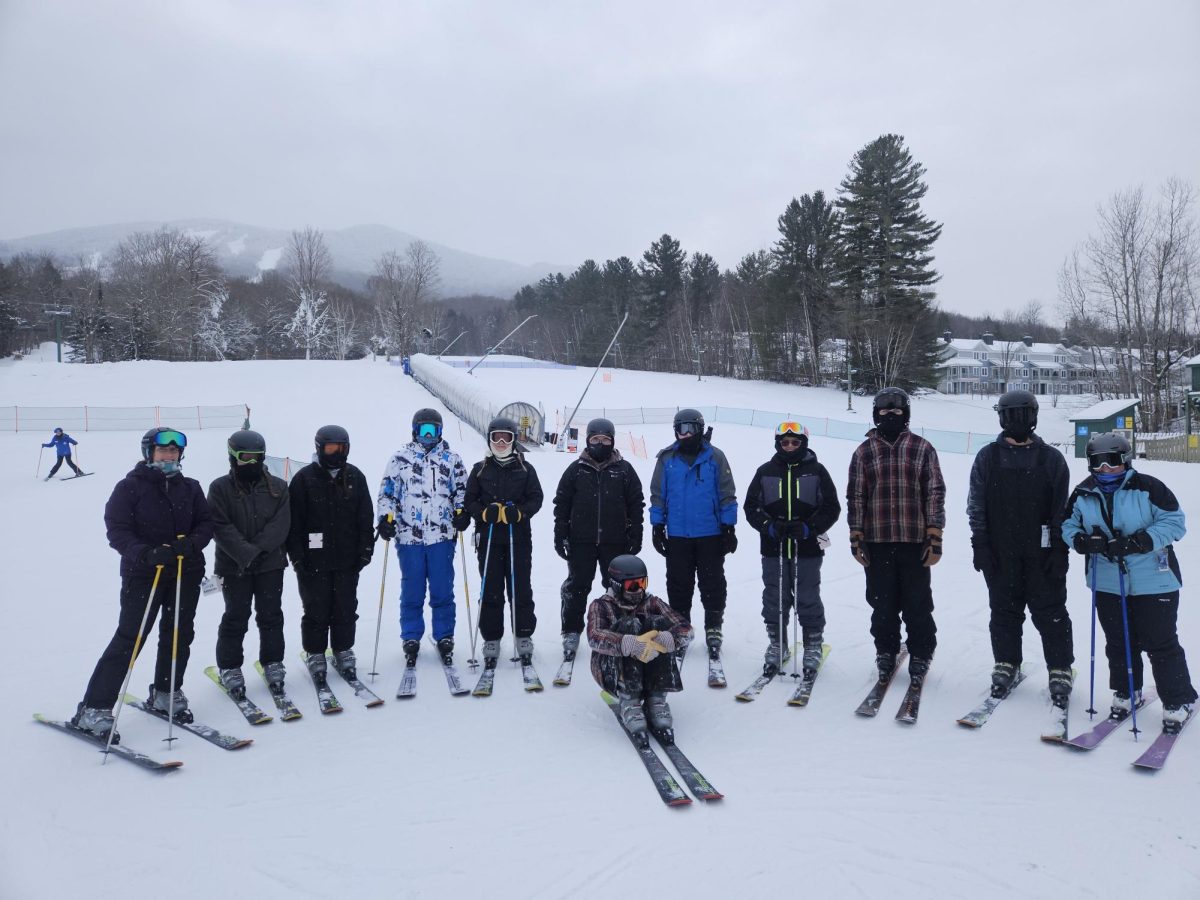 BMU students pose for a group photo prior to ski lessons at Burke Mountain Resort during J-term.