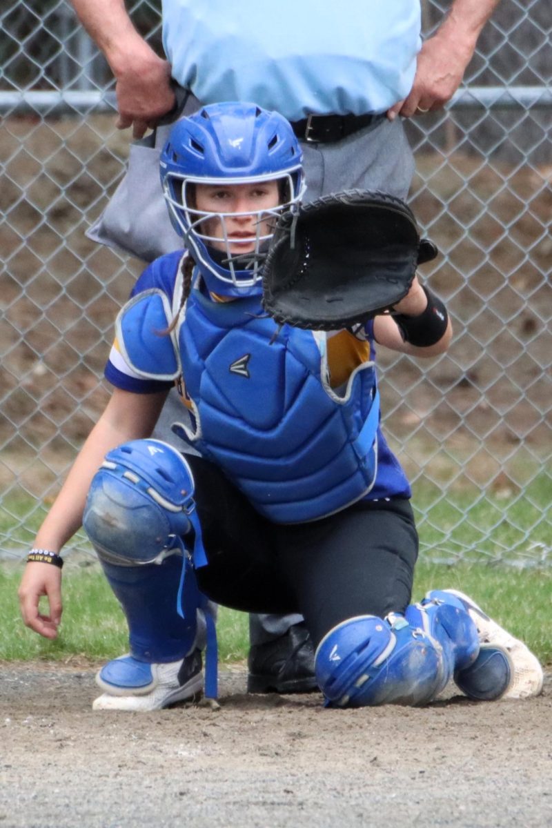 Sophomore Ava Kingsbury catching for the Blue Mountain Bucks, on April 29, 2025. 