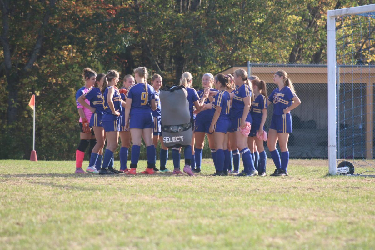 BMU girls huddle up in a team meeting prior to their game with Paine MTN on Monday September 29, on Ron Brown Athletic Field. 
