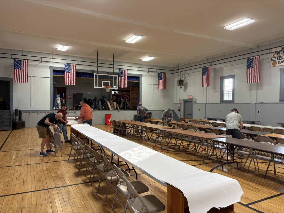 Local community members are setting up for the Groton chicken pie supper on Thursday, October 3, 2025, at the Groton Community Building. The chicken pie supper is an annual tradition that wraps up Fall Foliage in Groton. 
