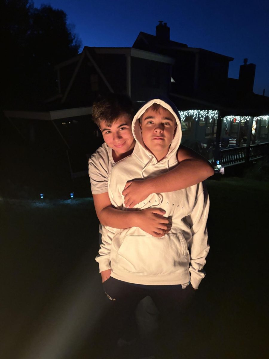 A pair of exchange students from Spain stand by a fire on September 27th, 2025. The exchange students are happy while getting to know their exchange siblings.