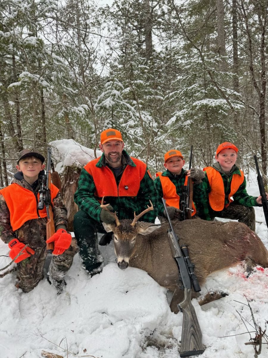 Elliott Kendall, Nick Kendall, Mason Gandin, and Liam Spear smile with a 6-point buck shot in Pittsburgh NH by Nick on Friday, November 28th, 2025.