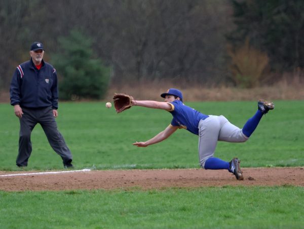 Blue Mountain's Brody Scott ranges far to his right to make the stop in the top of the 5th.  Blue Mountain  put away the Engineers 14-0 in a mercy rule shortened game. 